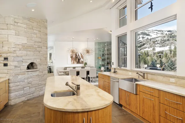 a kitchen with sink refrigerator and stove