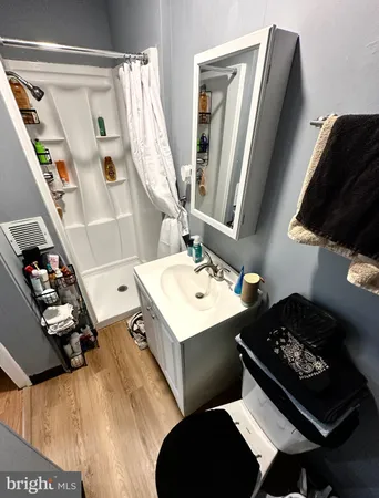 a living room with furniture and a mirror