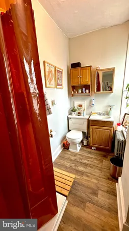 a bedroom with furniture and a rug