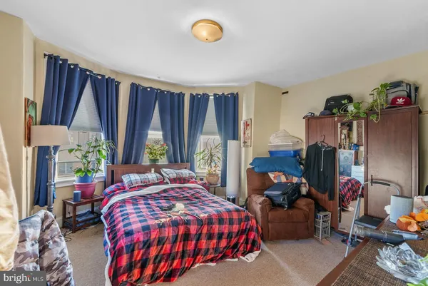 a bedroom with bed and a window