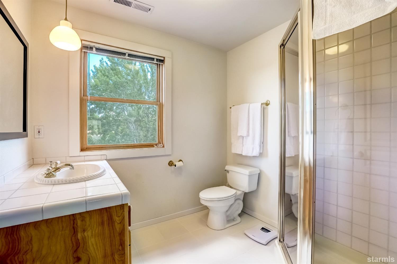 604 River Ranch Road Woodfords, CA 96120 - Photo 16 of 25 a bathroom with a sink a toilet and shower