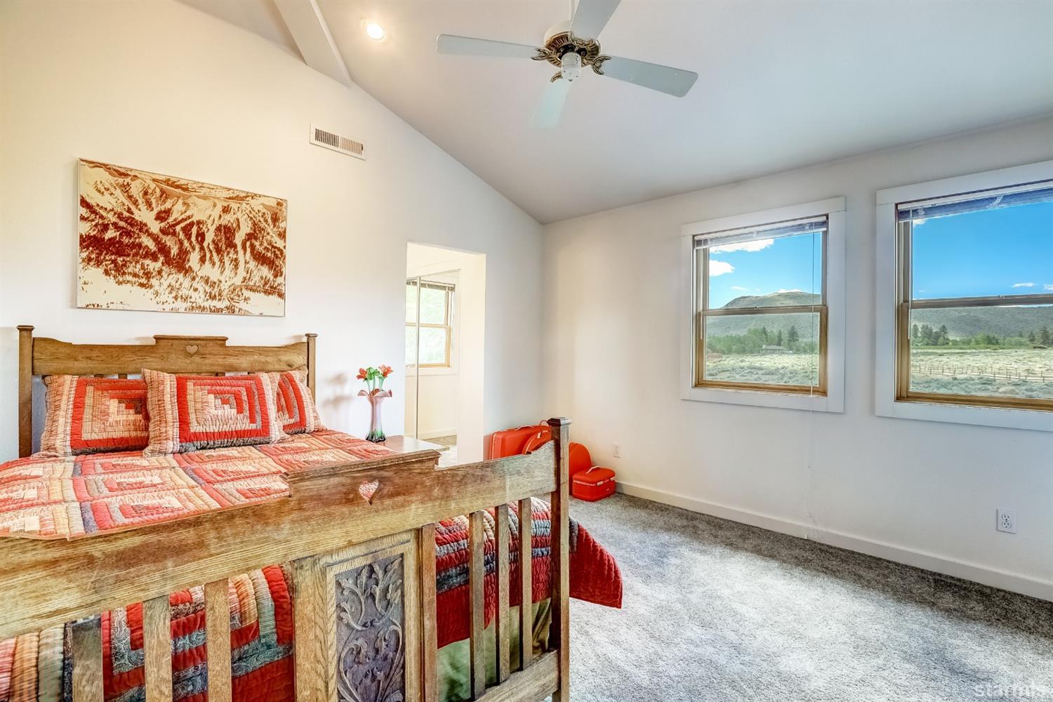 604 River Ranch Road Woodfords, CA 96120 - Photo 17 of 25 a bedroom with a bed and a table in it