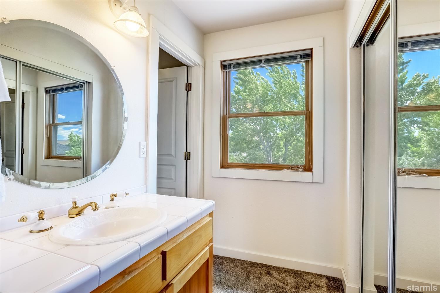 604 River Ranch Road Woodfords, CA 96120 - Photo 18 of 25 a bathroom with a sink and a mirror