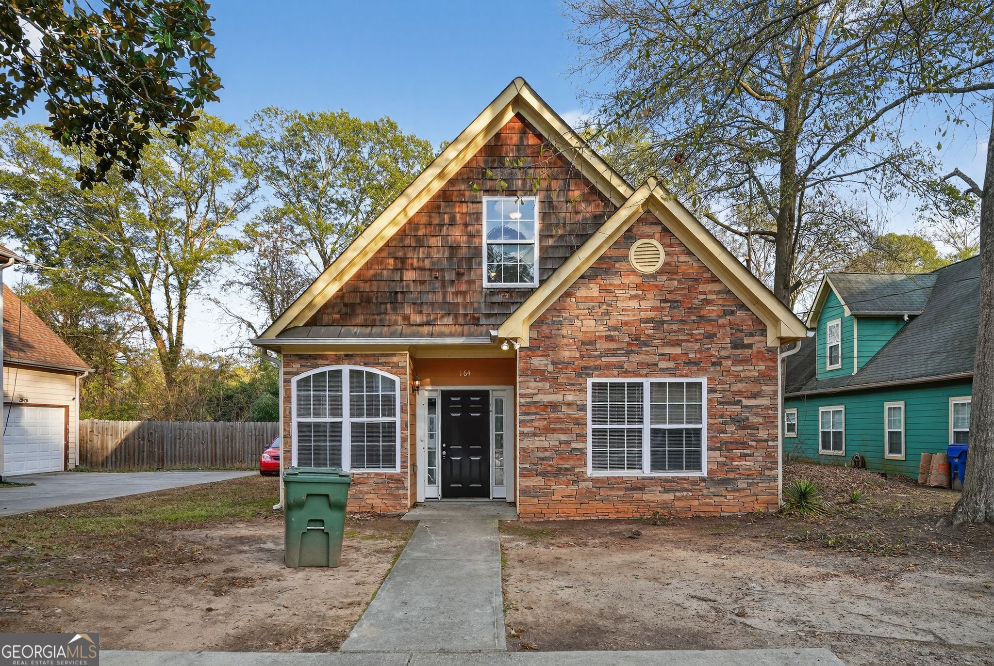 a front view of a house with garden