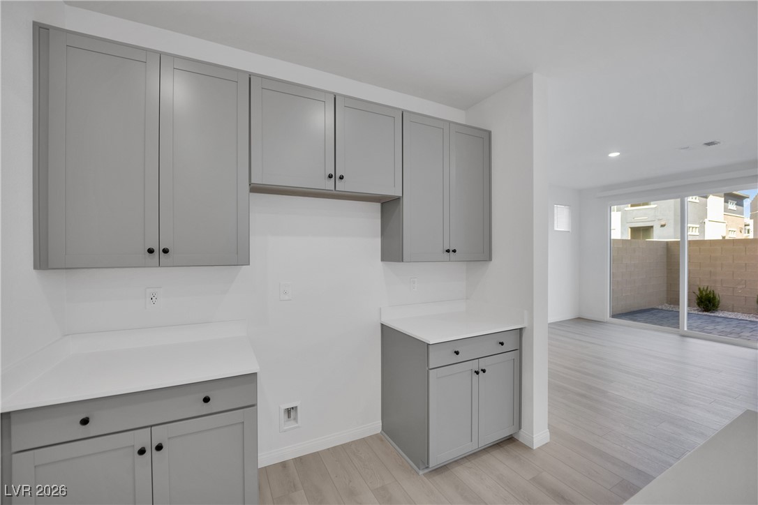 9136 Rivington Avenue Las Vegas, NV 89148 - Photo 13 of 43 Kitchen featuring gray cabinetry, light wood finished floors, and recessed lighting