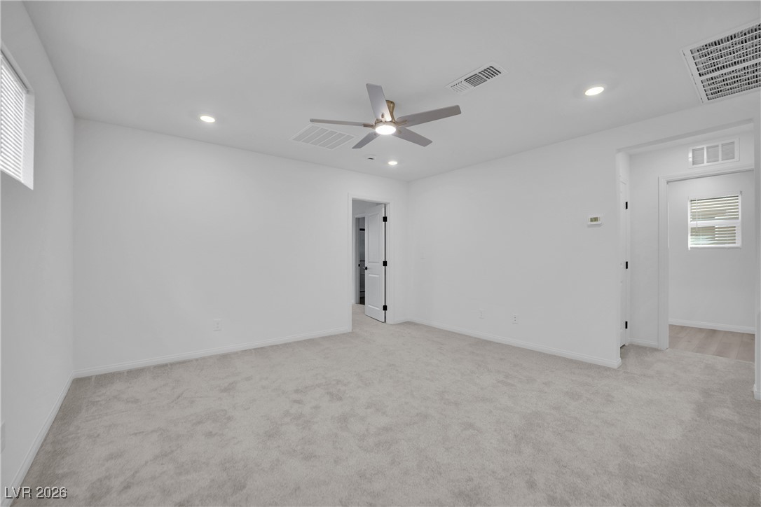 9136 Rivington Avenue Las Vegas, NV 89148 - Photo 26 of 43 Empty room featuring light colored carpet, recessed lighting, ceiling fan, and cooling unit