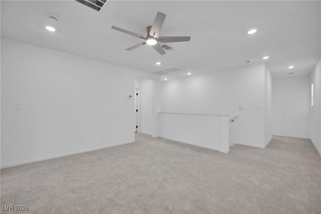 9136 Rivington Avenue Las Vegas, NV 89148 - Photo 27 of 43 Unfurnished room featuring light carpet, recessed lighting, and ceiling fan