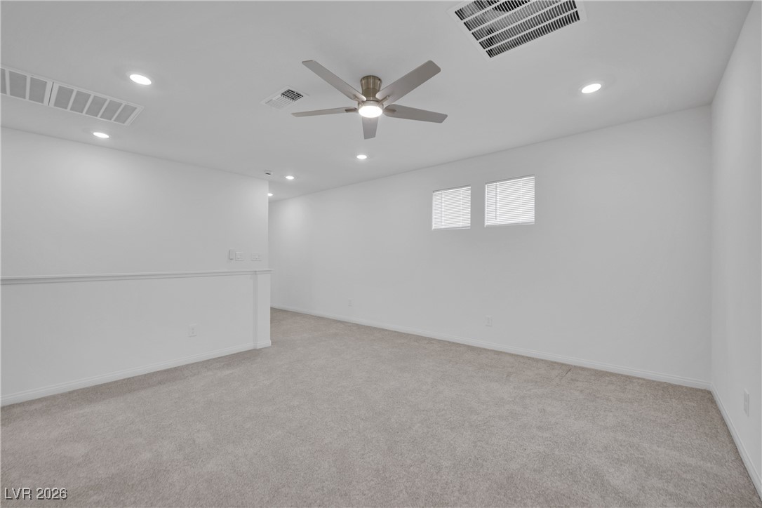9136 Rivington Avenue Las Vegas, NV 89148 - Photo 28 of 43 Spare room featuring recessed lighting, light colored carpet, and ceiling fan