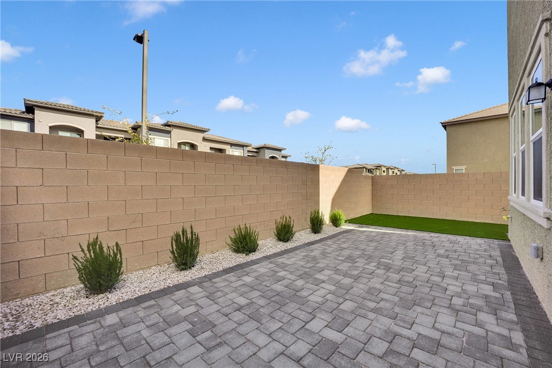9136 Rivington Avenue Las Vegas, NV 89148 - Photo 36 of 43 Fenced backyard with a patio