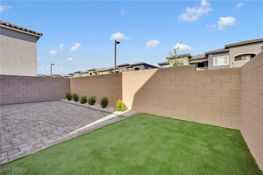 9136 Rivington Avenue Las Vegas, NV 89148 - Photo 38 of 43 Fenced backyard with a patio