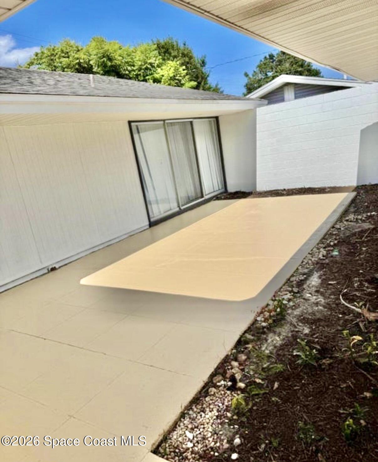 938 Brunswick Lane Rockledge, FL 32955 - Photo 12 of 21 Frnt courtyard off primary w/o furn.