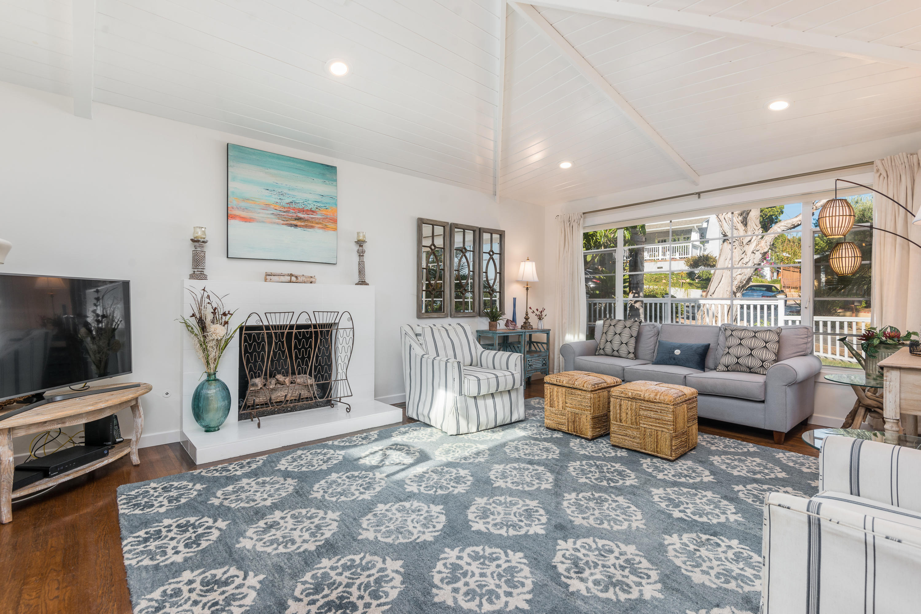 429 Terrace Road Santa Barbara, CA 93109 - Photo 3 of 15 a living room with furniture flat screen tv and a fireplace