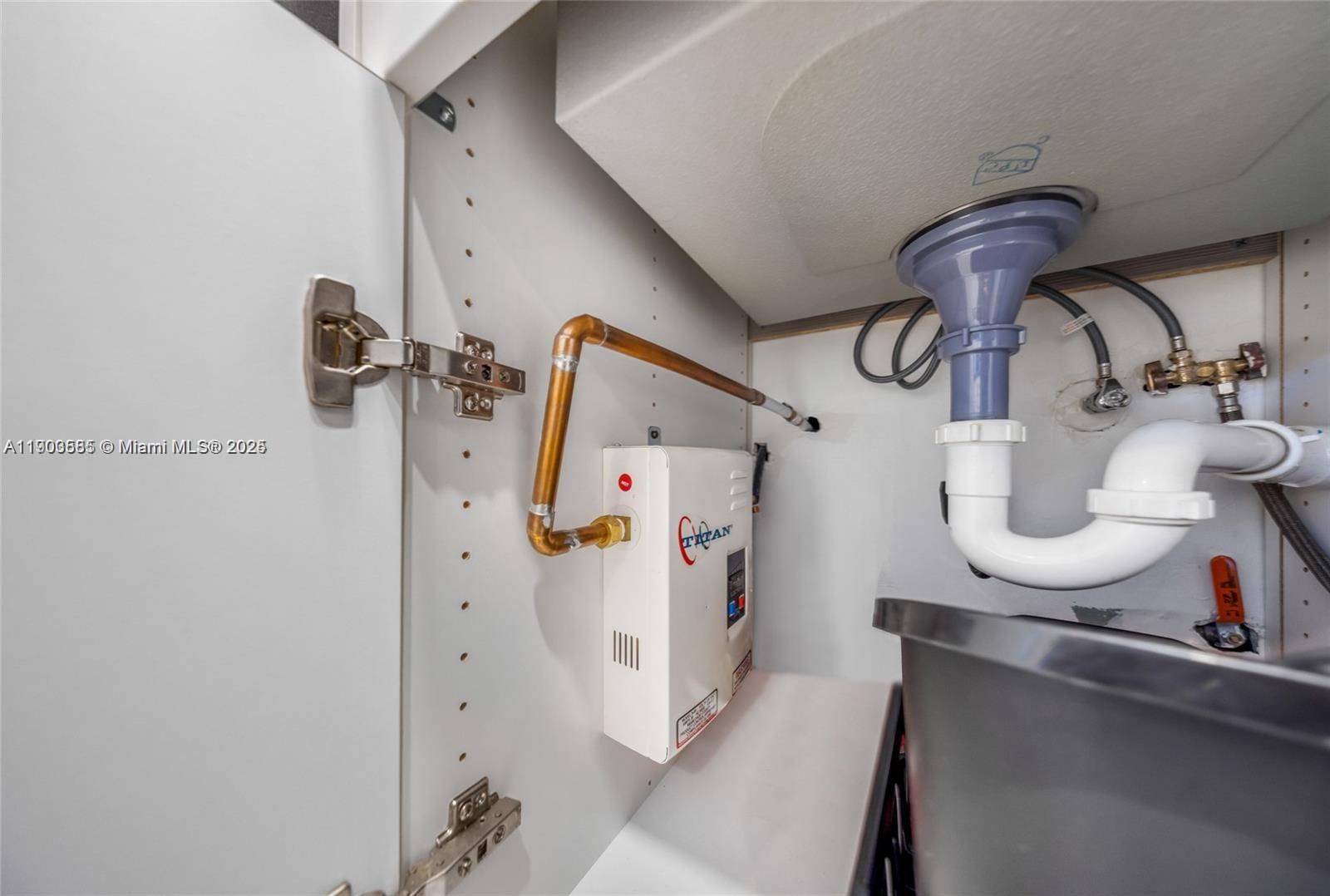 15610 Northeast 6th Avenue, Unit 33D Miami, FL 33162 - Photo 13 of 18 a bathroom with a sink and mirror