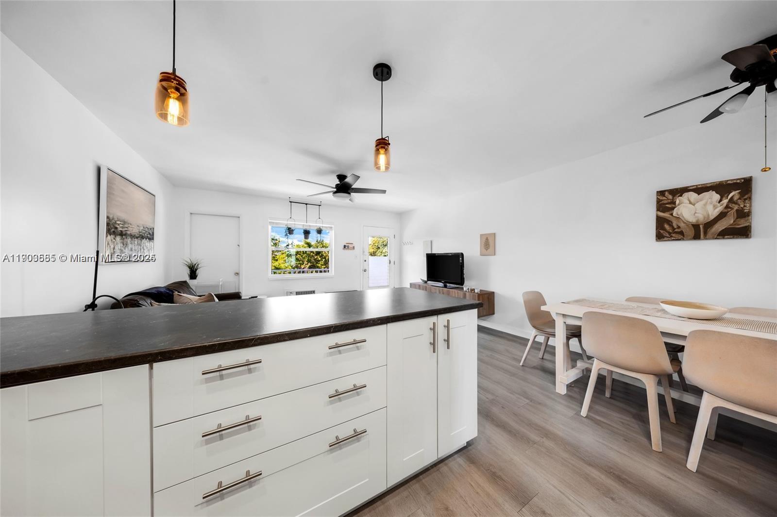 15610 Northeast 6th Avenue, Unit 33D Miami, FL 33162 - Photo 10 of 18 a kitchen with a sink and cabinets