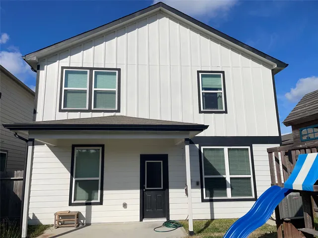 a view of a house with large windows