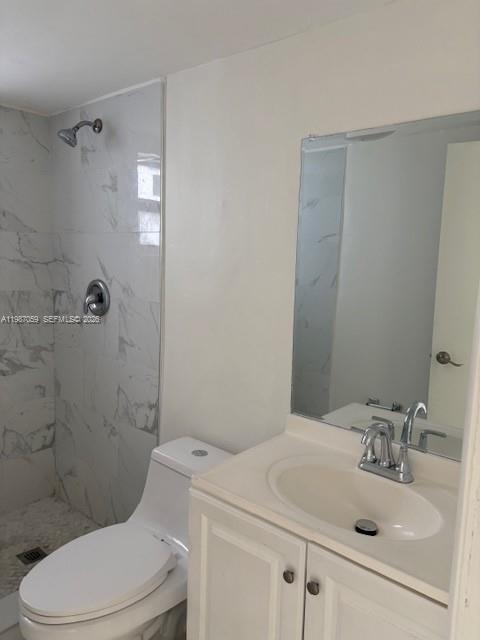 828 Southwest 20th Avenue, Unit 1 Miami, FL 33135 - Photo 5 of 10 a bathroom with a sink a toilet and shower