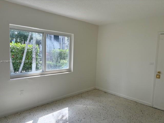 828 Southwest 20th Avenue, Unit 1 Miami, FL 33135 - Photo 7 of 10 an empty room with a window