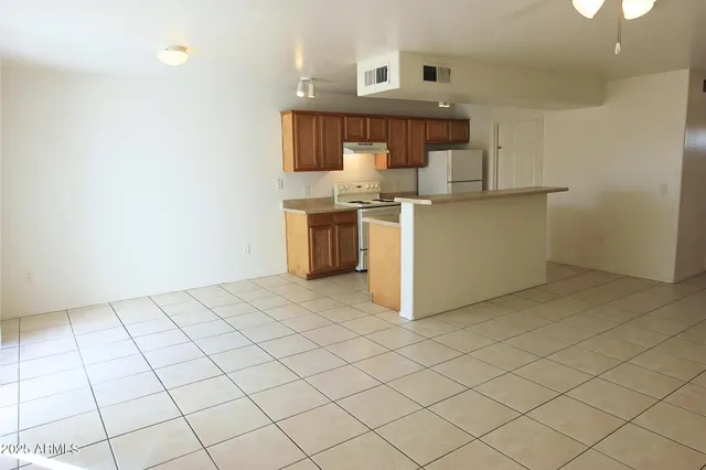 a kitchen with a sink cabinets and stainless steel appliances