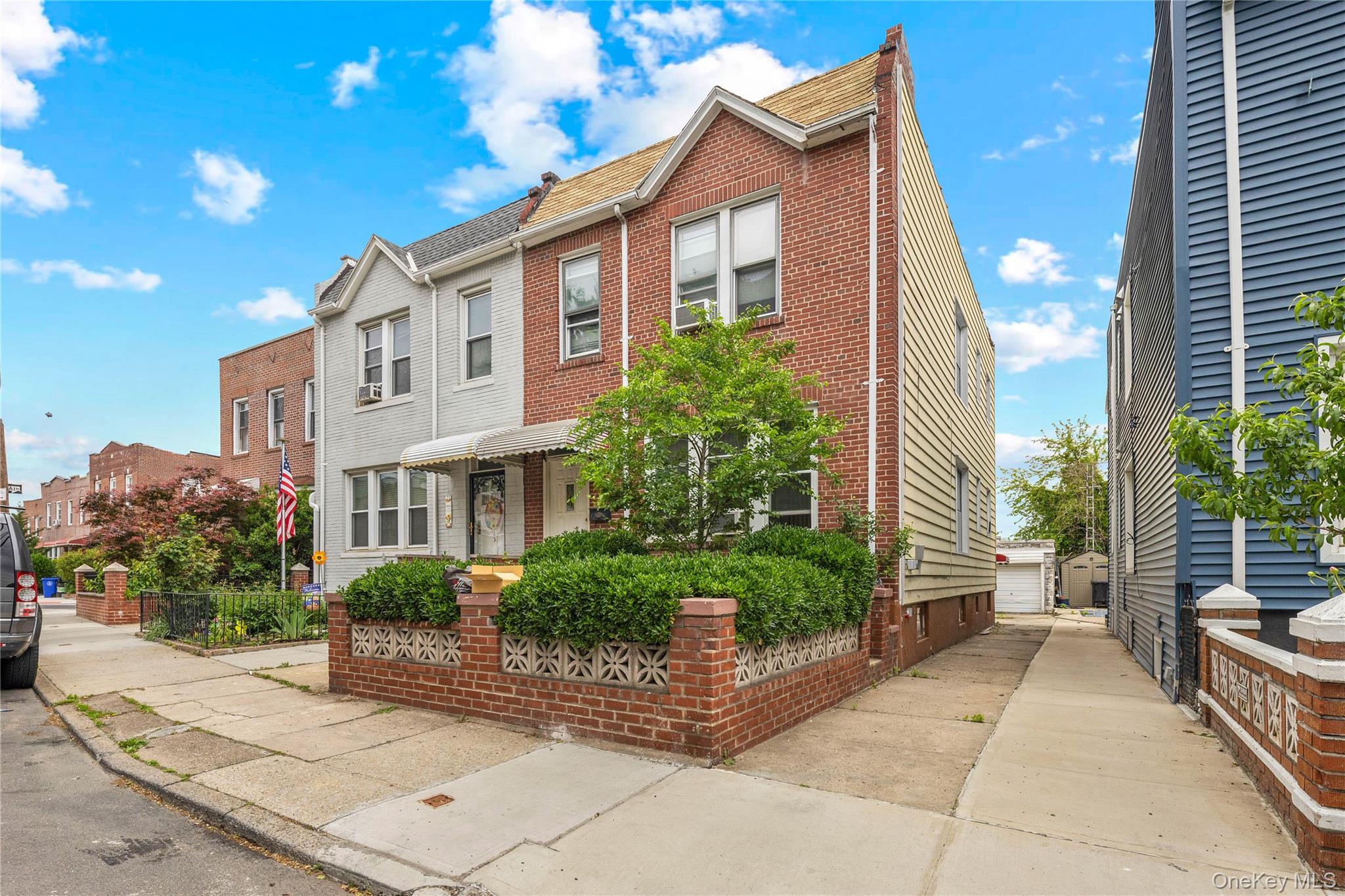 37-07 20th Road Queens, NY 11105 - Photo 6 of 24 a view of a brick house with plants