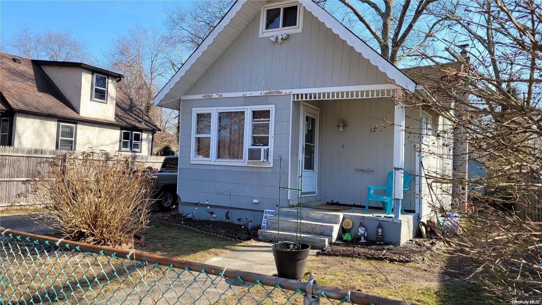 12 Orient Road Mastic Beach, NY 11951 - Photo 1 of 1 a view of a house with a yard