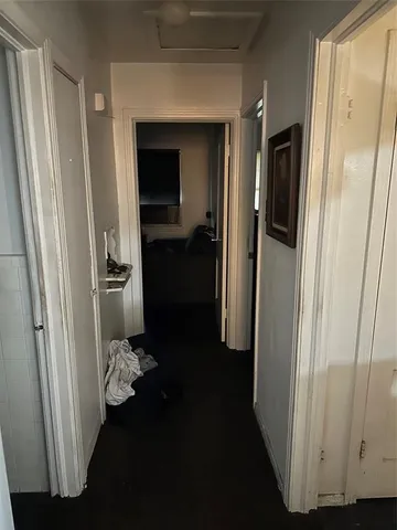 a room with water heater and wooden floor