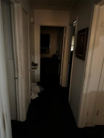 a bathroom with a toilet and a shower curtain