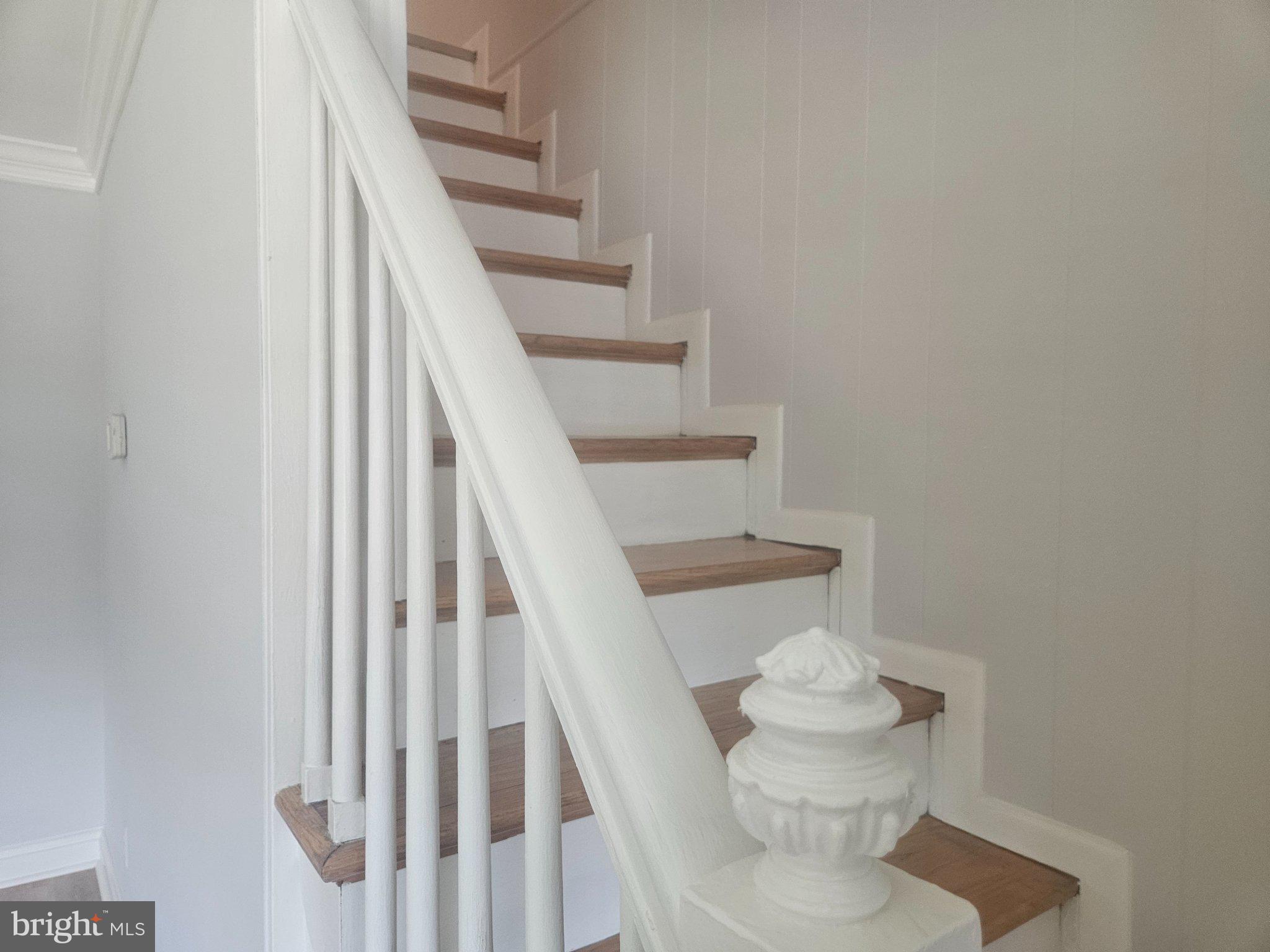 635 48th Street Baltimore, MD 21224 - Photo 6 of 14 Elegant staircase with classic charm.