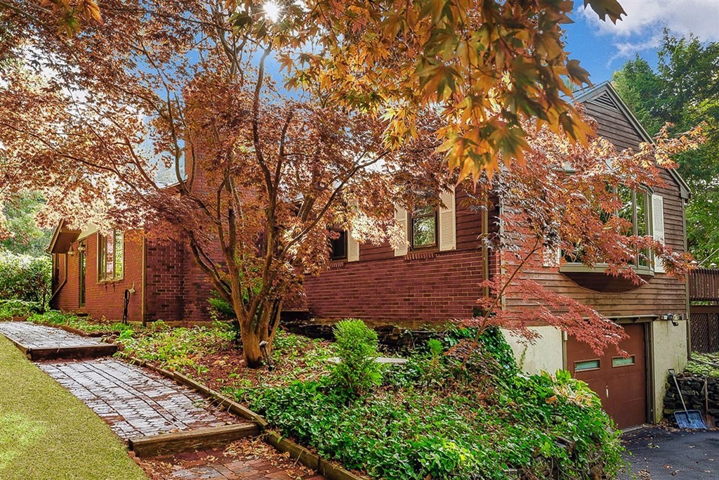 120 Chadwick Road Haverhill, MA 01835 - Photo 1 of 29 a view of a yard with plants and large trees