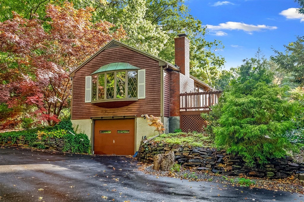 120 Chadwick Road Haverhill, MA 01835 - Photo 2 of 29 a front view of a house with garden