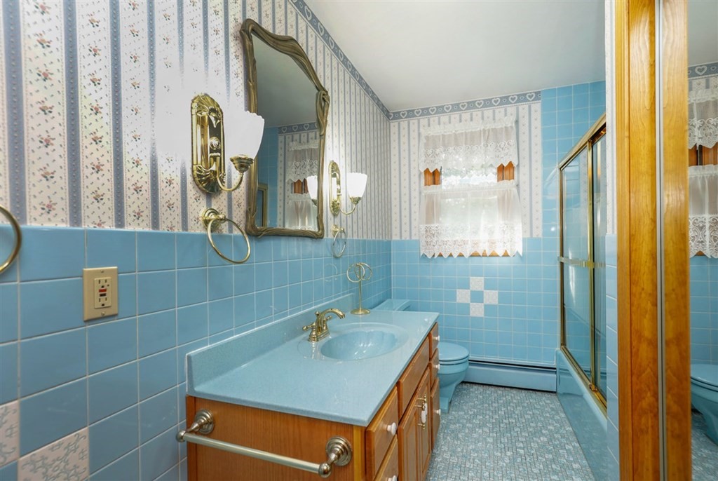 120 Chadwick Road Haverhill, MA 01835 - Photo 21 of 29 a bathroom with a sink and a mirror