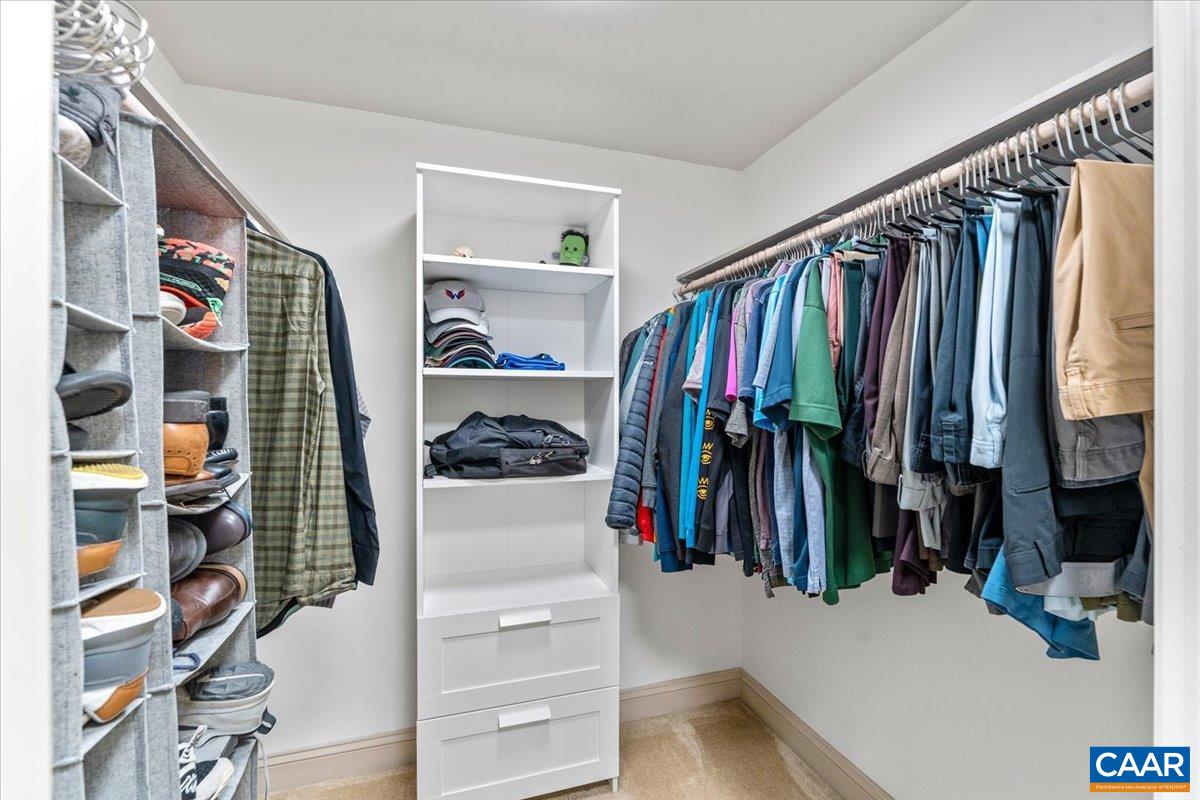 11760 Sunrise Valley Drive, Unit 208 Reston, VA 20191 - Photo 13 of 30 a view of walk in closet with clothes and shoes