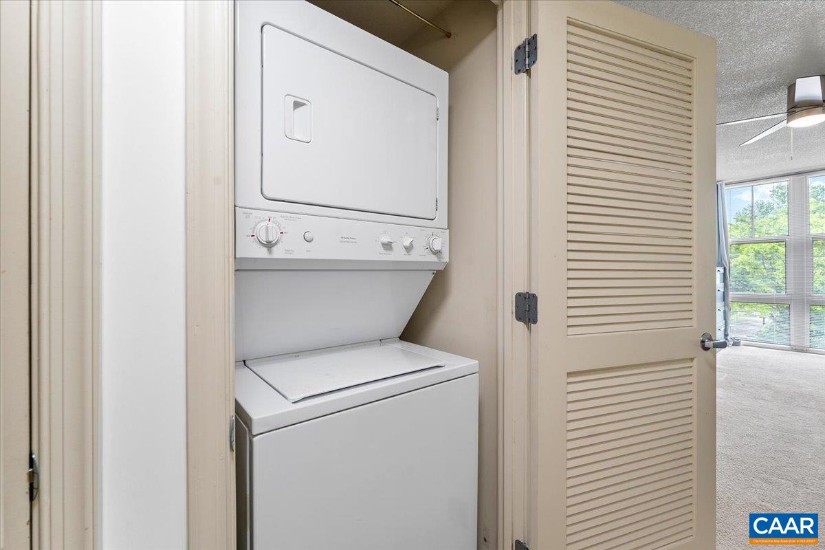 11760 Sunrise Valley Drive, Unit 208 Reston, VA 20191 - Photo 17 of 30 a utility room with dryer and washer