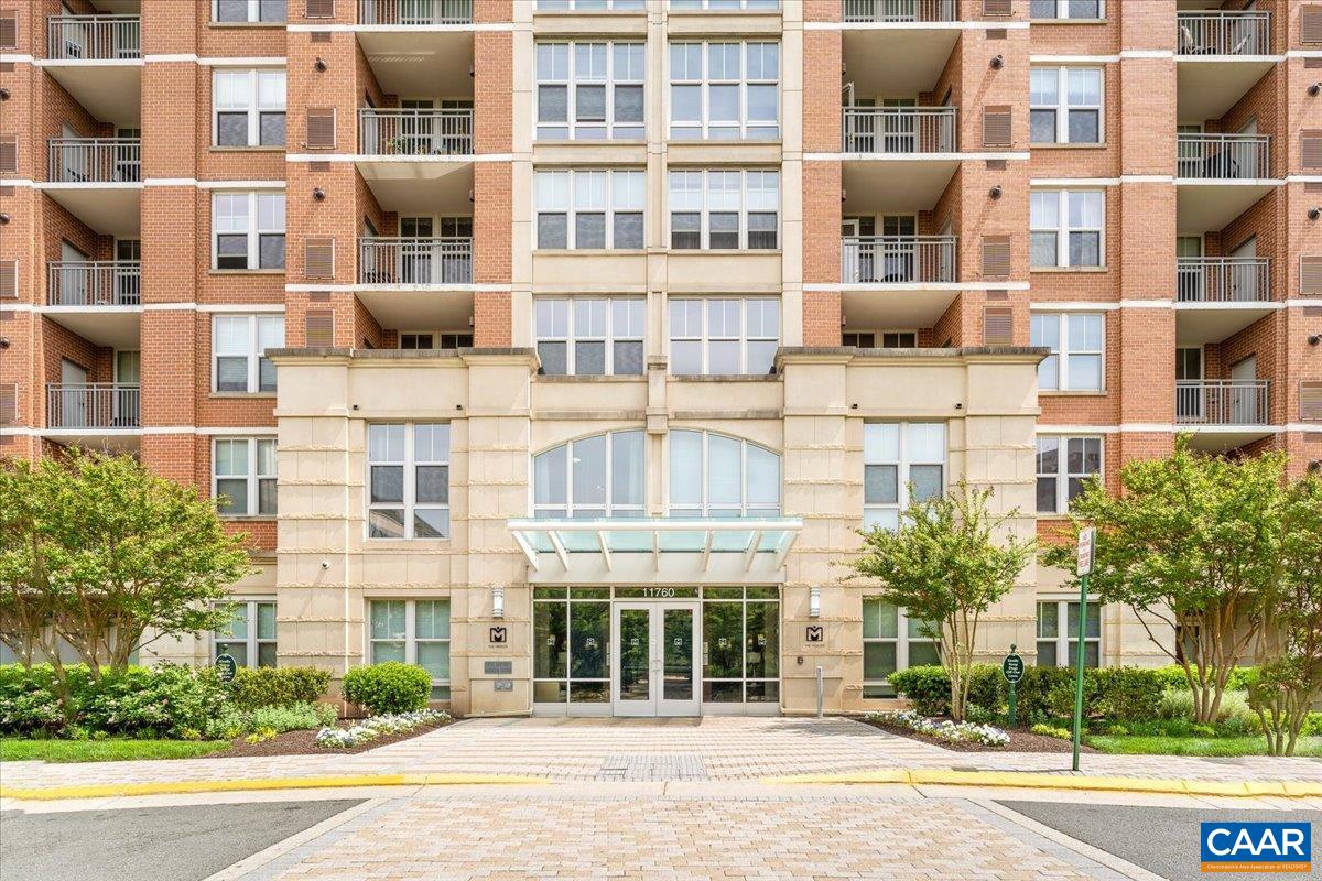11760 Sunrise Valley Drive, Unit 208 Reston, VA 20191 - Photo 24 of 30 a front view of a building with a street