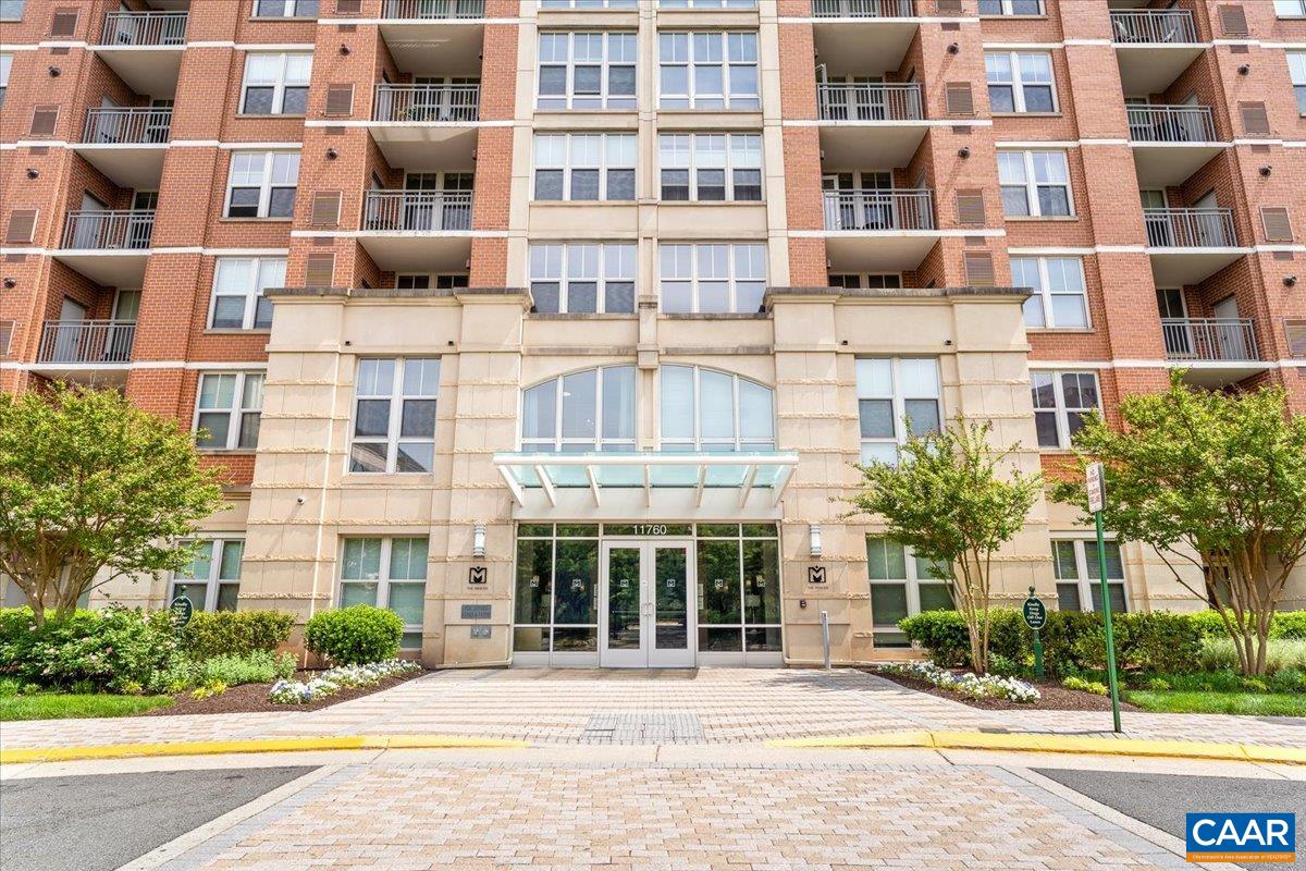 11760 Sunrise Valley Drive, Unit 208 Reston, VA 20191 - Photo 25 of 30 a front view of a building with a street