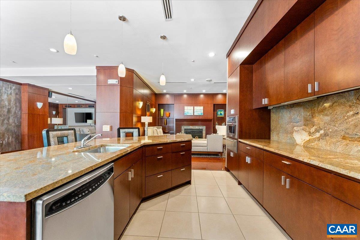 11760 Sunrise Valley Drive, Unit 208 Reston, VA 20191 - Photo 5 of 30 a large kitchen with stainless steel appliances and a counter space