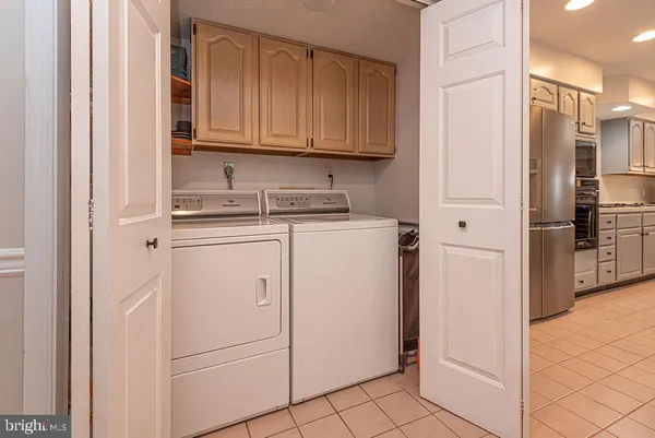 a bathroom with a toilet and a mirror