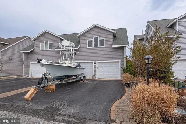 a view of a balcony with furniture and wooden floor