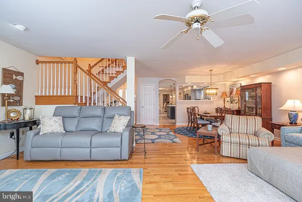 a kitchen with stainless steel appliances granite countertop a sink a stove and a microwave
