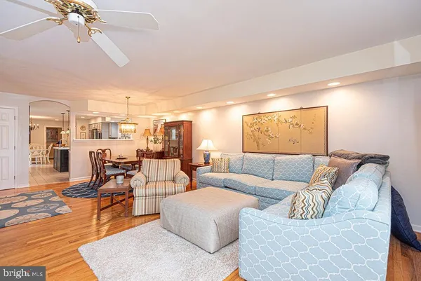 a spacious bedroom with a bed and a couch