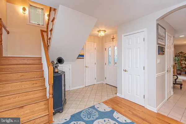 a kitchen with stainless steel appliances granite countertop a refrigerator and a stove