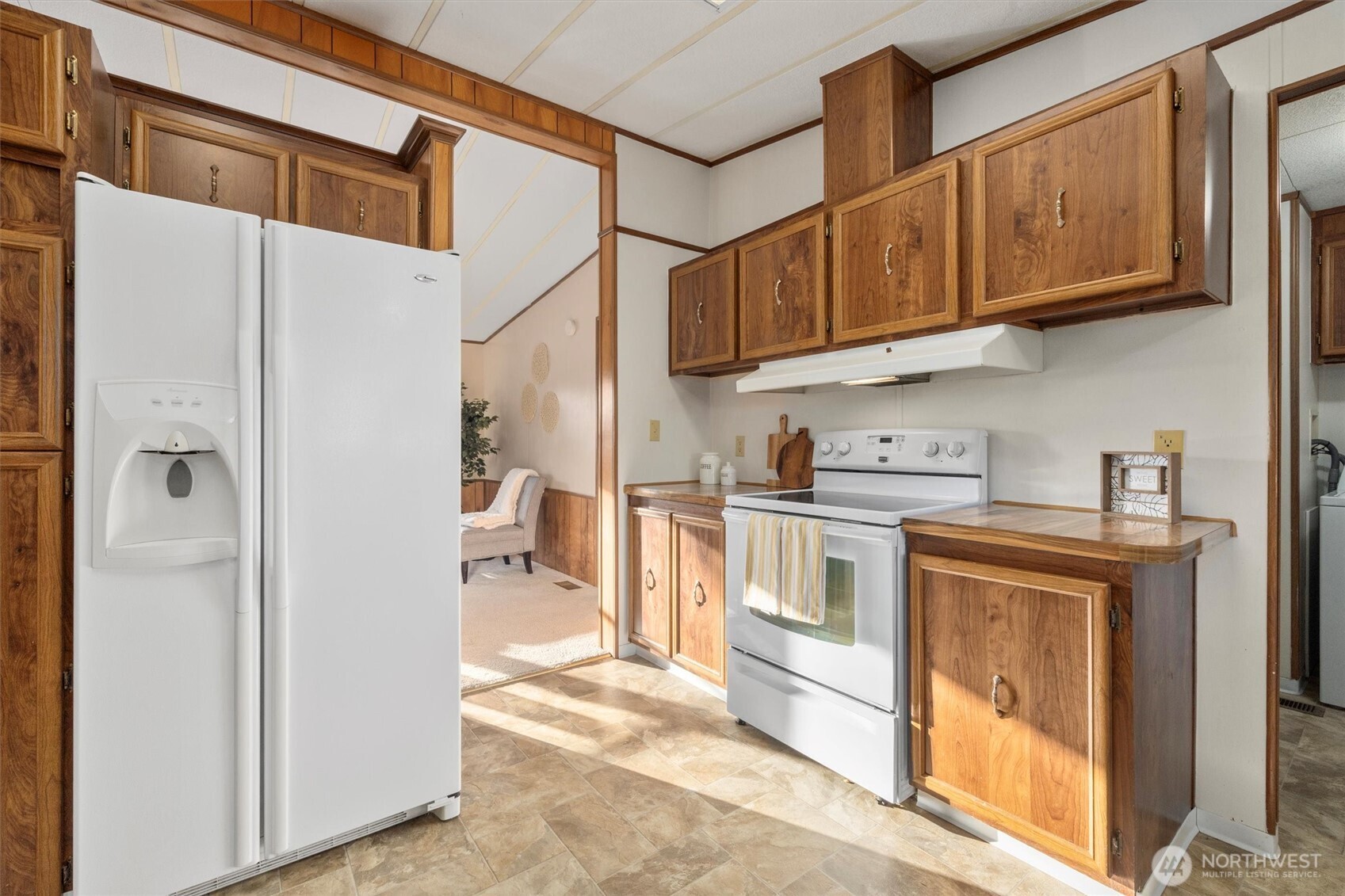24331 S Park Bothell, WA 98021 - Photo 17 of 40 a kitchen with stainless steel appliances granite countertop a refrigerator a stove and a sink with cabinets