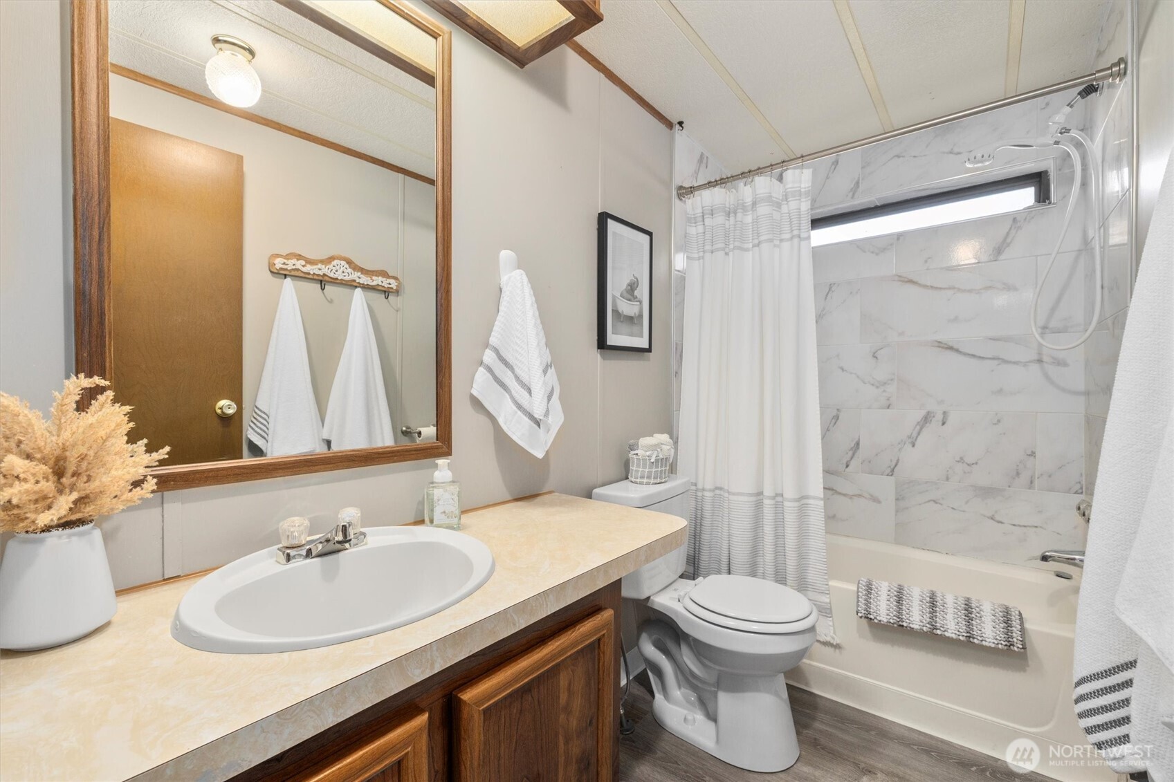 24331 S Park Bothell, WA 98021 - Photo 24 of 40 a bathroom with a sink a toilet and shower