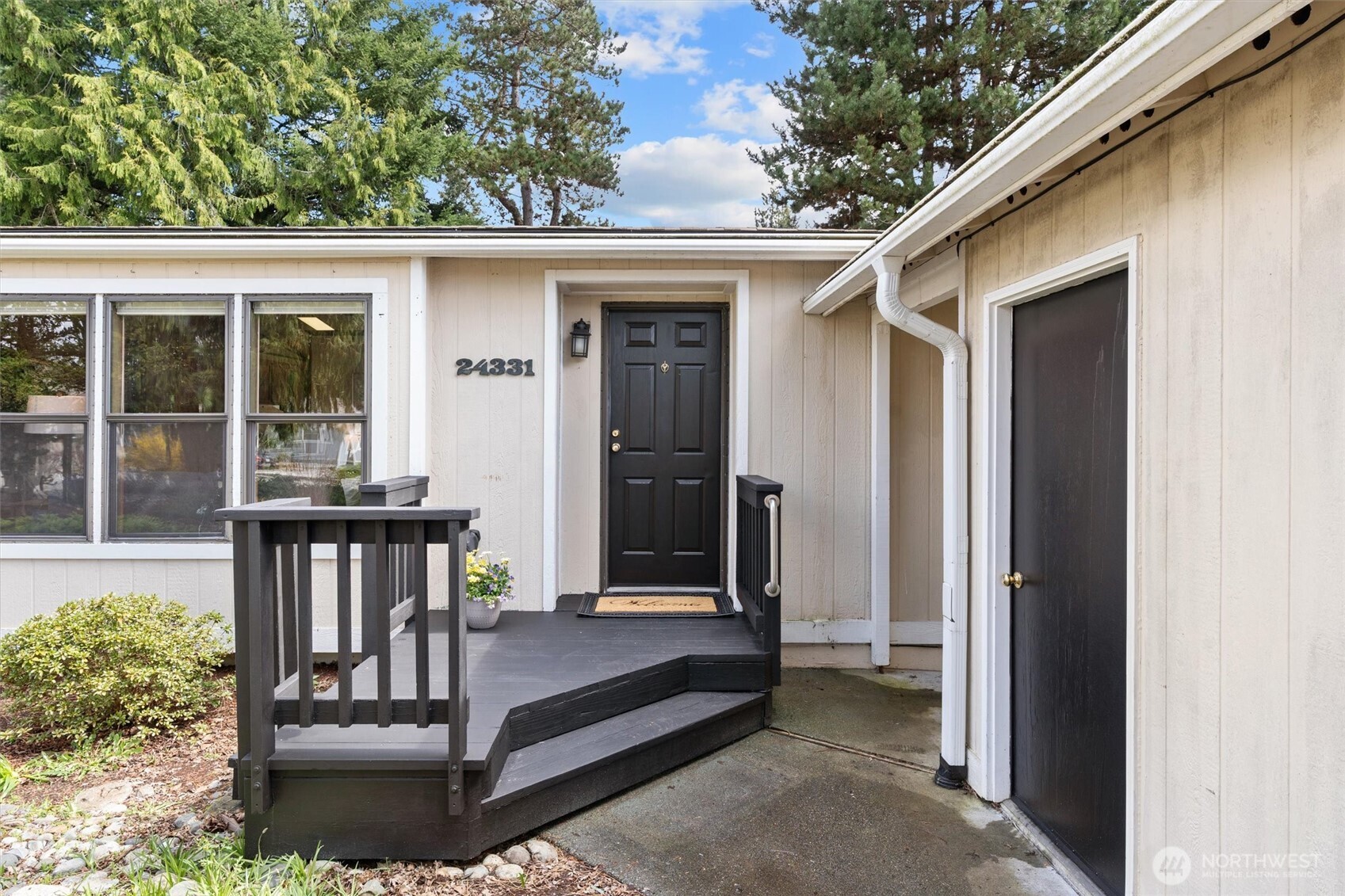 24331 S Park Bothell, WA 98021 - Photo 5 of 40 a view of a house with a balcony and floor to ceiling window and wooden floor