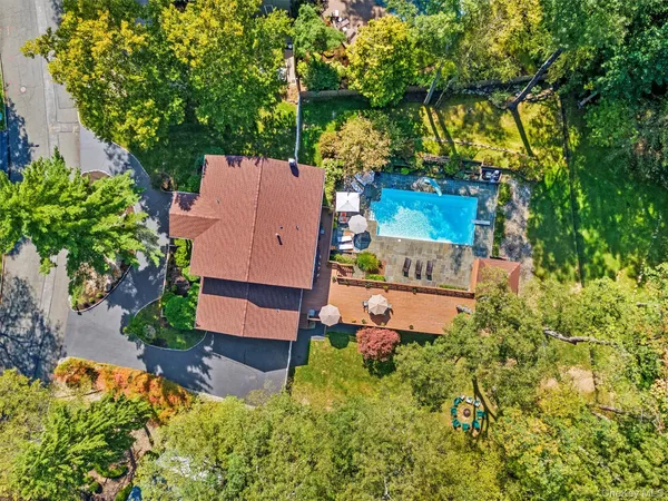 an aerial view of a house with a yard