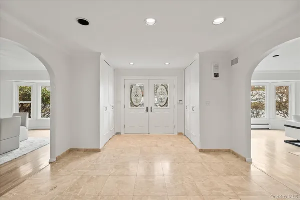 a view of a big room with closet and windows
