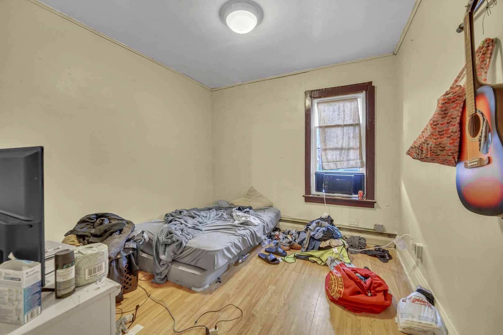 720 Meeker Avenue Joliet, IL 60432 - Photo 14 of 20 a bedroom with a bed and a window