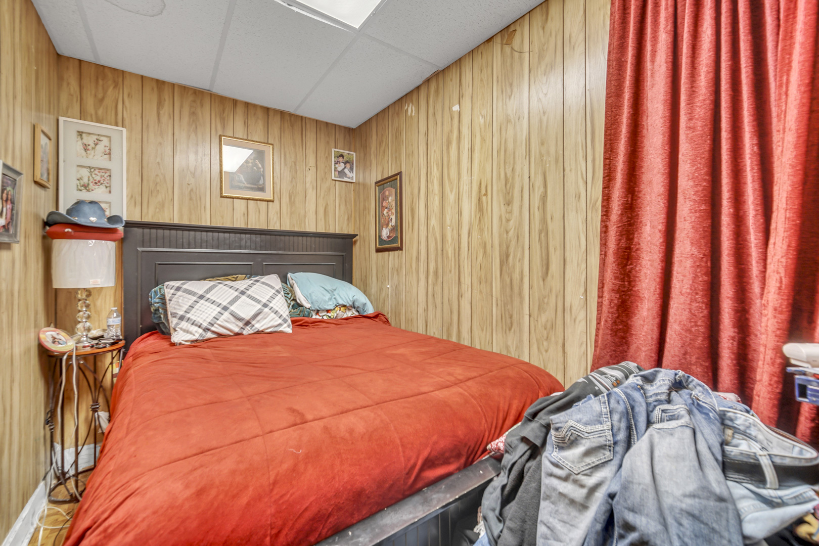 720 Meeker Avenue Joliet, IL 60432 - Photo 17 of 20 a bed sitting in a bedroom next to a window and a curtain