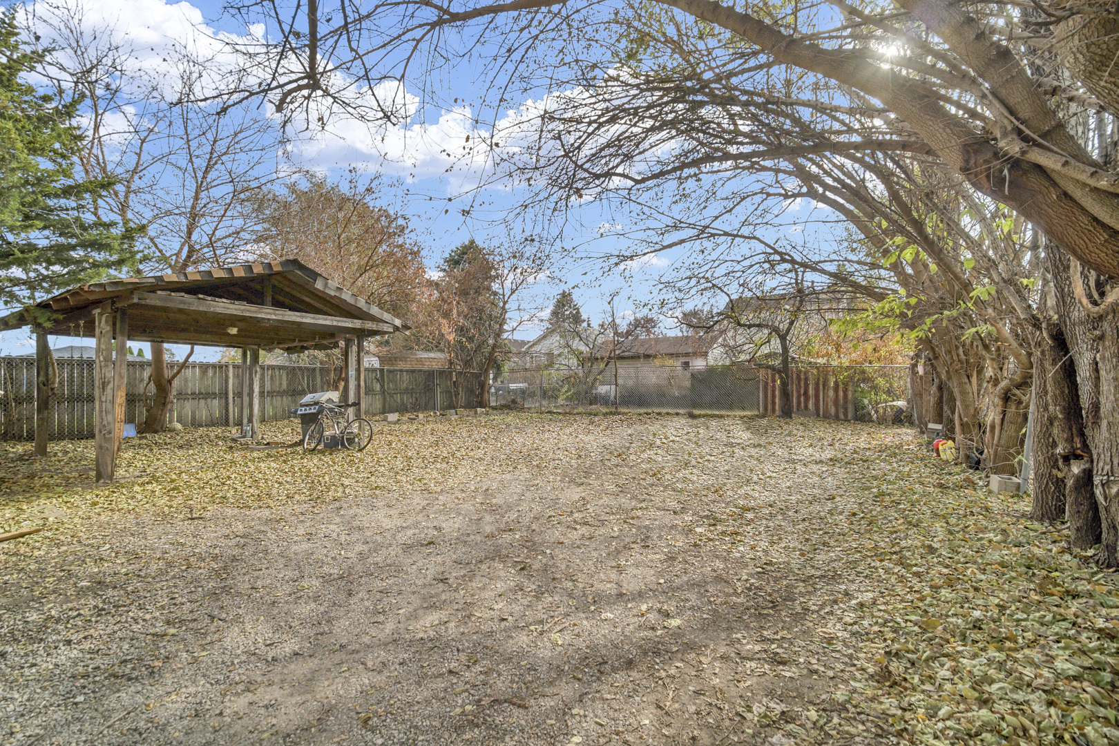 720 Meeker Avenue Joliet, IL 60432 - Photo 20 of 20 a backyard of a house with table and chairs