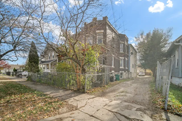 a view of a building with a yard