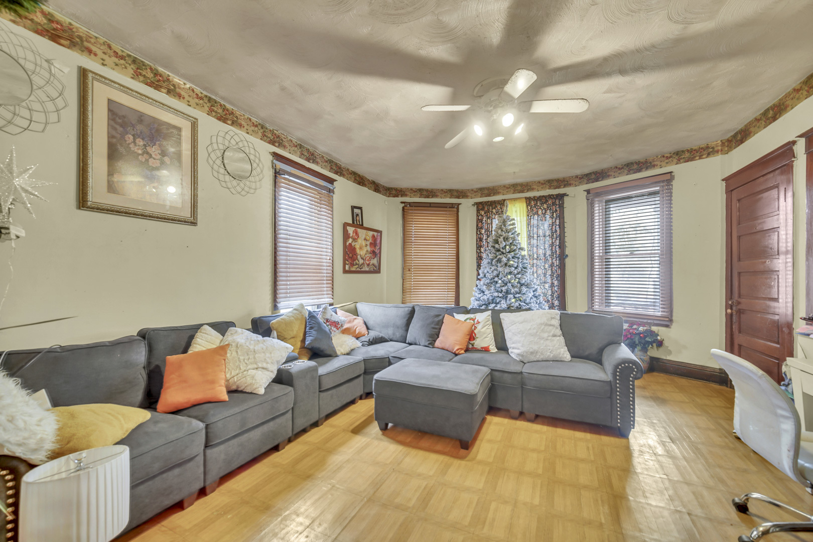 720 Meeker Avenue Joliet, IL 60432 - Photo 5 of 20 a living room with furniture and large windows